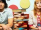 two-students-with-books-between-them